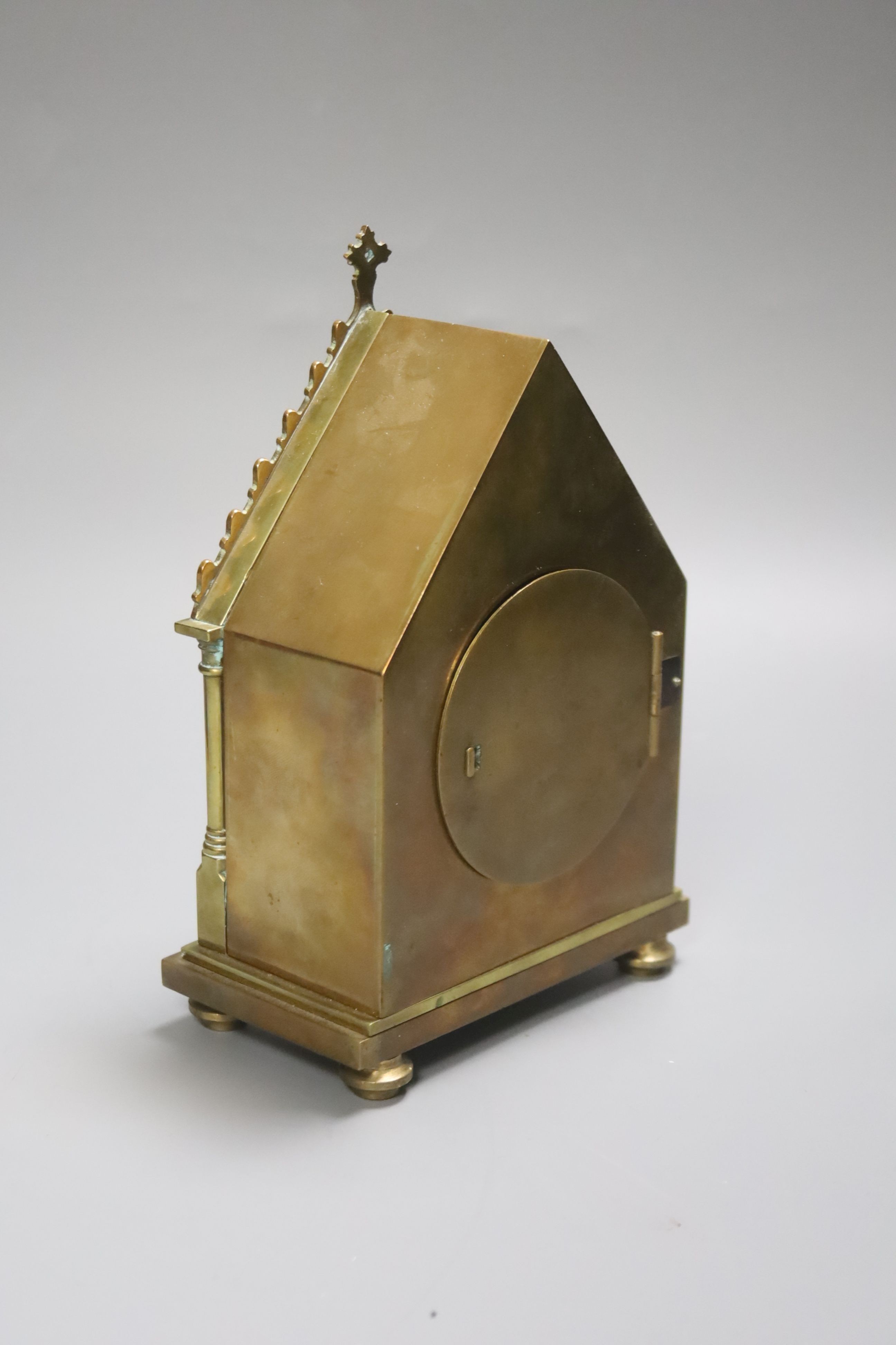 A late 19th century French Gothic brass cased carriage timepiece, with felt-lined carrying case, 16cm high, 11cm wide.